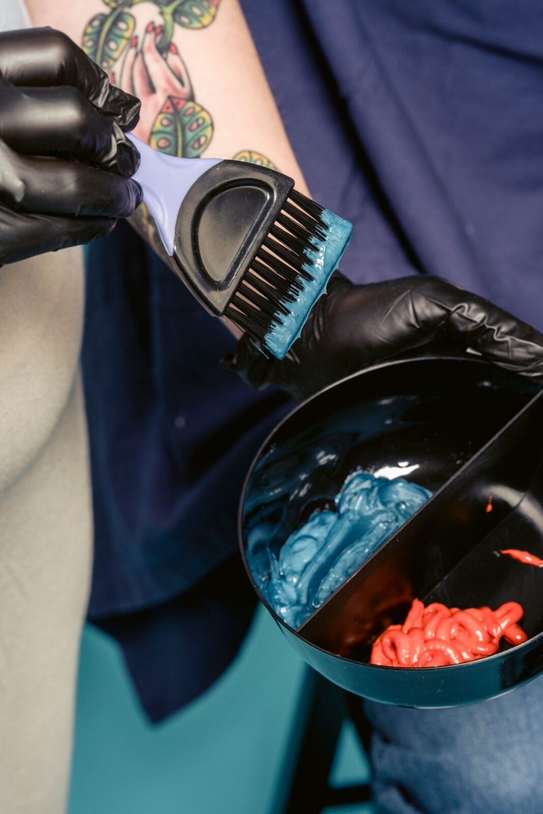 A colourist mixing hair colour in the CHAIR colour bar