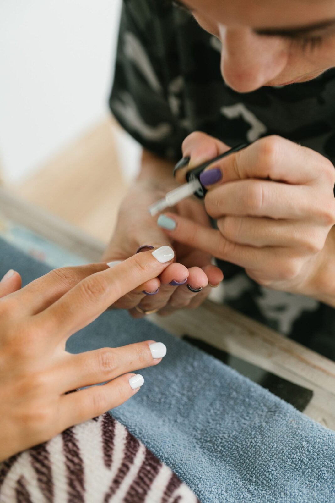 A client having gel nails applied at CHAIR