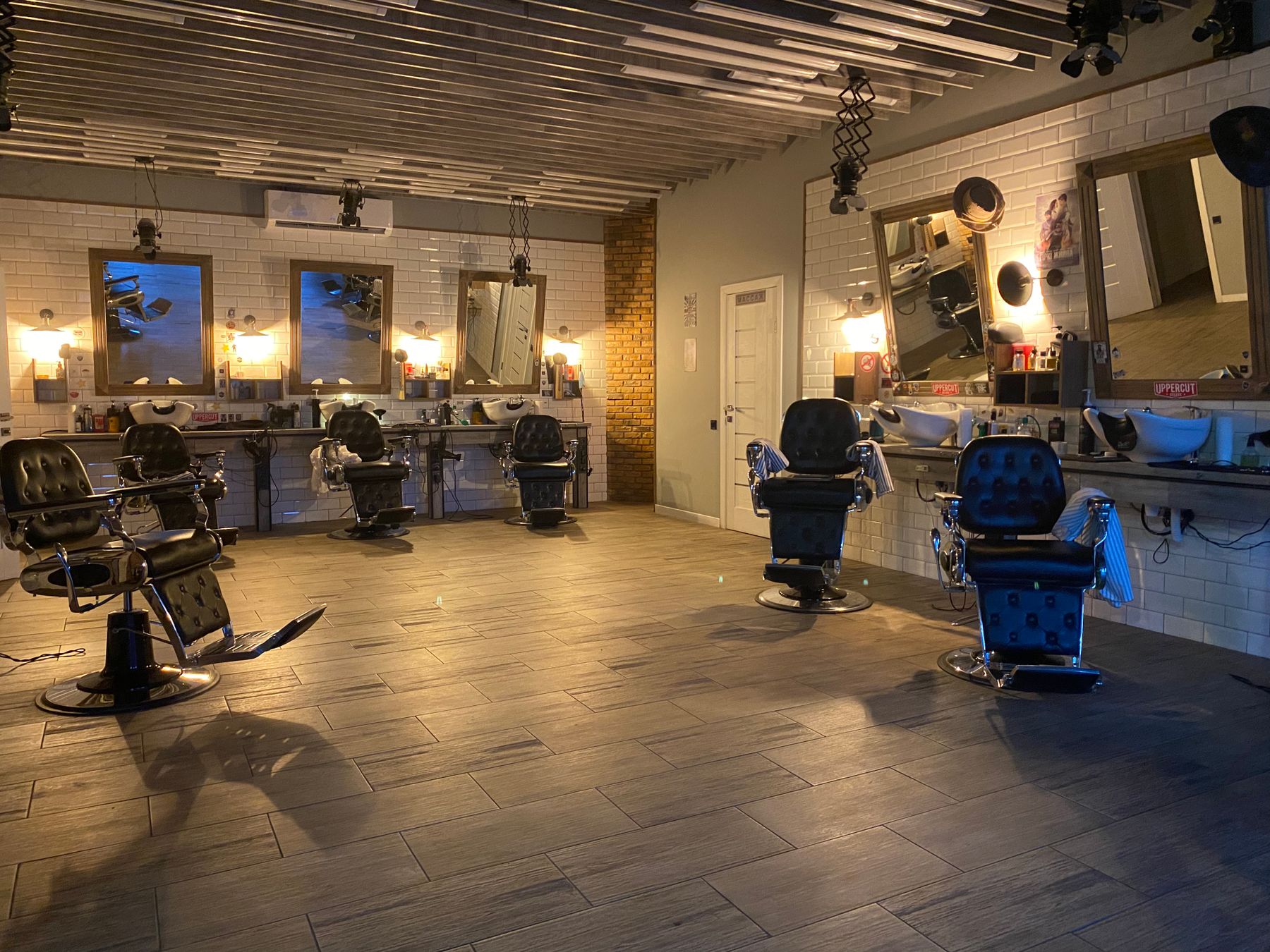 Wide view of the CHAIR salon floor and styling stations